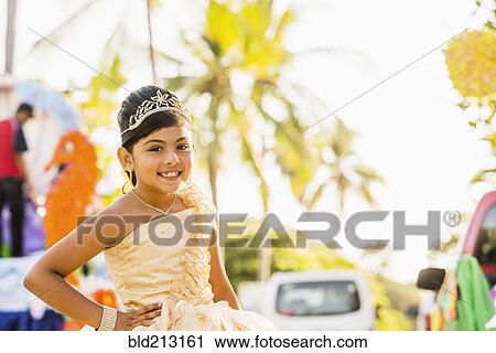 Hispanic girl posing in ornate dress and tiara View Large Photo Image Stock Image - Hispanic girl posing in ornate dress and tiara. Fotosearch