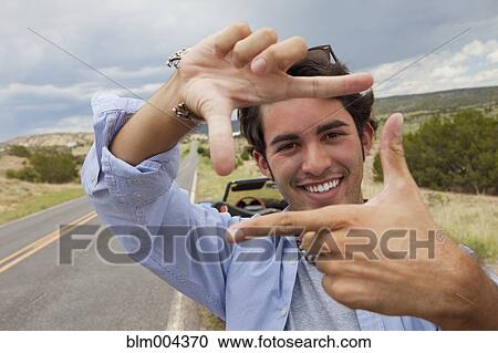 Hispanic man gesturing on roadside View Large Photo Image Stock Image - Hispanic man gesturing on roadside. Fotosearch