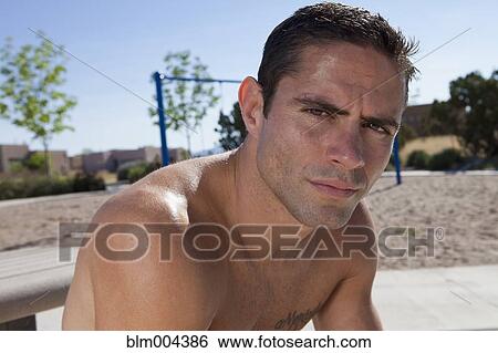 Stock Photograph - Hispanic man looking serious. Fotosearch