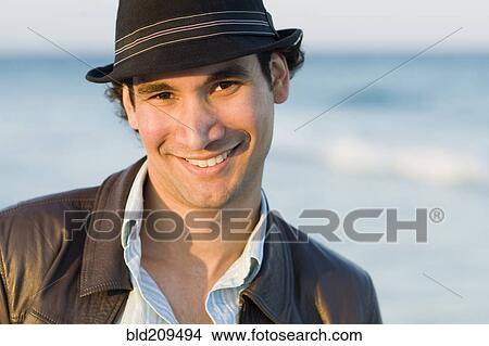 Hispanic man smiling outdoors View Large Photo Image Picture - Hispanic man smiling outdoors. Fotosearch