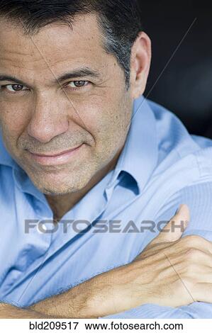 Stock Photo - Hispanic man smiling. Fotosearch