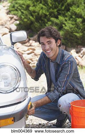 Hispanic man washing car View Large Photo Image Stock Photo - Hispanic man washing car. Fotosearch