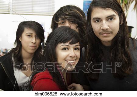 Hispanic students smiling in classroom View Large Photo Image Stock Photo - Hispanic students smiling in classroom. Fotosearch