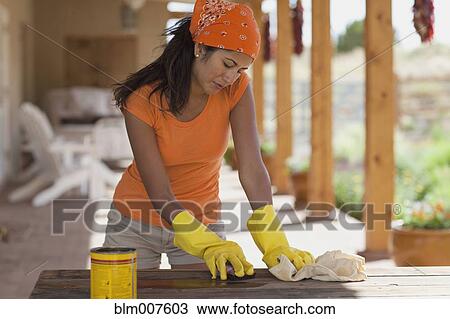 Hispanic woman cleaning table View Large Photo Image Stock Image - Hispanic woman cleaning table. Fotosearch