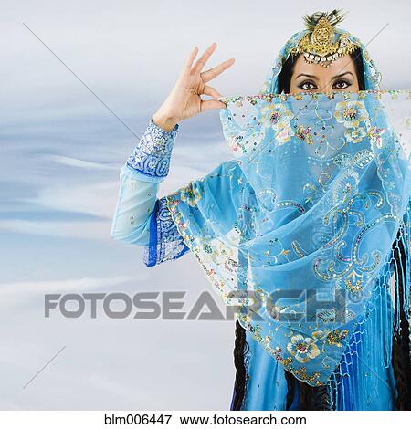 Stock Photo - Hispanic woman in ornate headdress and scarf. Fotosearch