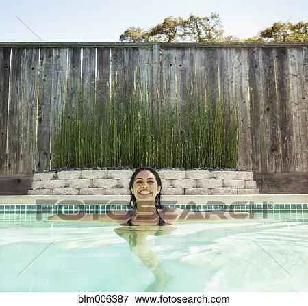 Hispanic woman in swimming pool View Large Photo Image Stock Photo - Hispanic woman in swimming pool. Fotosearch