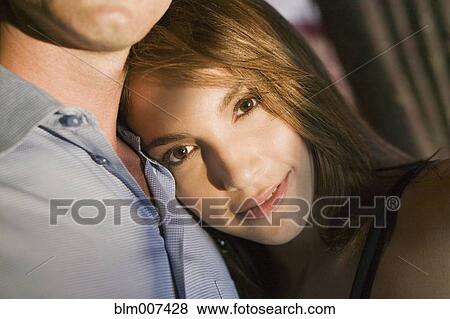 Stock Photo - Hispanic woman leaning on husband. Fotosearch