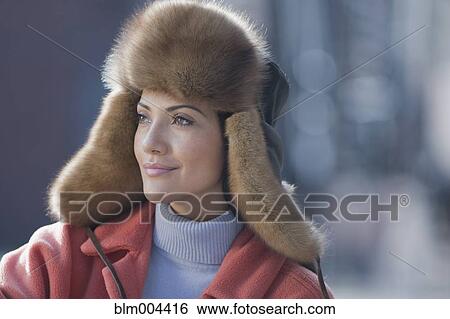 Hispanic woman wearing fur hat View Large Photo Image Stock Photograph - Hispanic woman wearing fur hat. Fotosearch