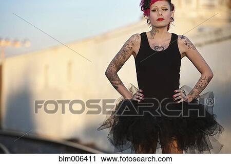 Hispanic woman with tattoos wearing tutu View Large Photo Image Stock Image - Hispanic woman with tattoos wearing tutu. Fotosearch