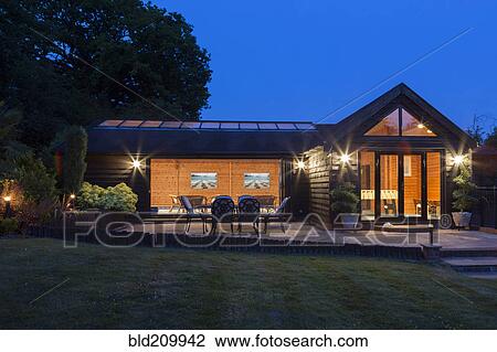 Illuminated modern house View Large Photo Image Stock Image - Illuminated modern house. Fotosearch