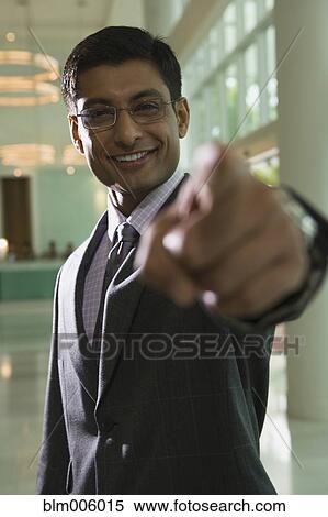Indian businessman pointing View Large Photo Image Stock Photography - Indian businessman pointing. Fotosearch
