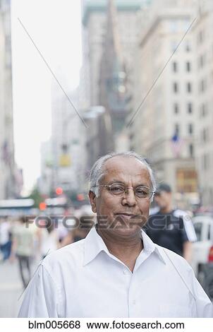 Indian man on urban street View Large Photo Image Stock Photo - Indian man on urban street. Fotosearch