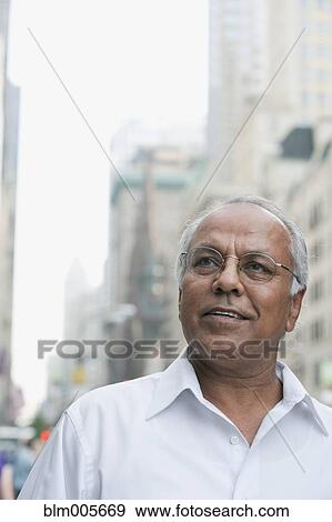 Indian man on urban street View Large Photo Image Stock Photo - Indian man on urban street. Fotosearch