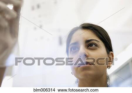 Picture - Indian scientist working in laboratory. Fotosearch