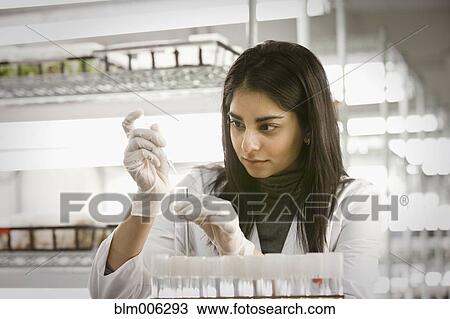 Stock Image - Indian scientist working in laboratory. Fotosearch