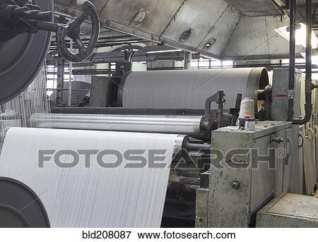 Stock Photo - Industrial loom in textile factory. Fotosearch