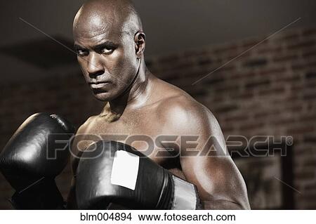 Intense African boxer with arms raised View Large Photo Image Picture - Intense African boxer with arms raised. Fotosearch