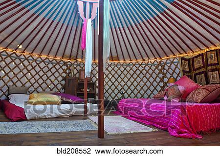 Stock Image - Interior of a Mongolian Yurt, used as summer retreat in Andalucia, Spain. Fotosearch