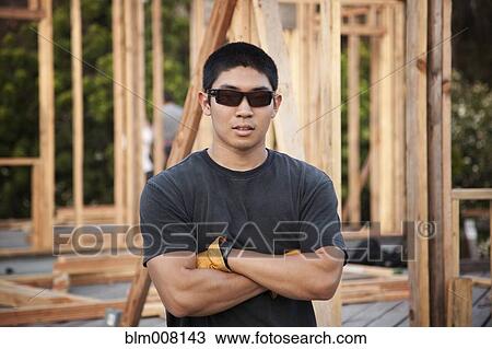 Japanese construction worker in sunglasses with arms crossed View Large Photo Image Stock Image - Japanese construction worker in sunglasses with arms crossed. Fotosearch