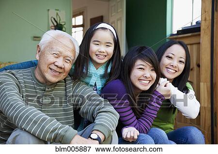 Stock Photo - Japanese family smiling together. Fotosearch