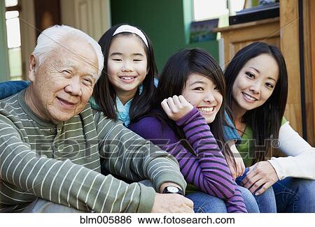 Stock Photograph - Japanese family smiling together. Fotosearch