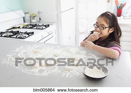Japanese girl eating dough View Large Photo Image Picture - Japanese girl eating dough. Fotosearch