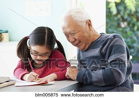 Japanese grandfather helping granddaughter with homework View Large Photo Image Stock Photography - Japanese grandfather helping granddaughter with homework. Fotosearch