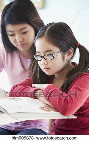 Japanese sisters doing homework View Large Photo Image Stock Photo - Japanese sisters doing homework. Fotosearch