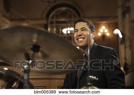 Jazz musician performing in nightclub View Large Photo Image Stock Photo - Jazz musician performing in nightclub. Fotosearch