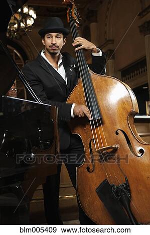 Jazz musician performing in nightclub View Large Photo Image Stock Photo - Jazz musician performing in nightclub. Fotosearch