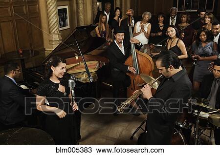 Stock Image - Jazz musicians performing in nightclub. Fotosearch