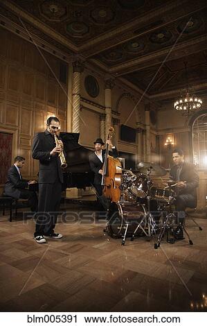 Jazz musicians performing in nightclub View Large Photo Image Stock Image - Jazz musicians performing in nightclub. Fotosearch