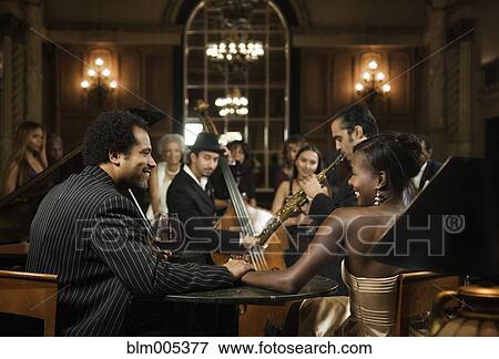 Stock Photo - Jazz musicians performing in nightclub. Fotosearch