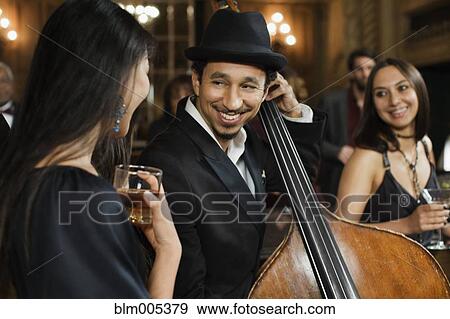 Jazz musicians performing in nightclub View Large Photo Image Stock Photo - Jazz musicians performing in nightclub. Fotosearch