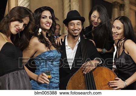 Stock Photo - Jazz musicians with female admirers. Fotosearch