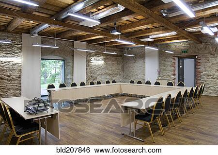 Stock Photograph - L-shaped table in conference room. Fotosearch