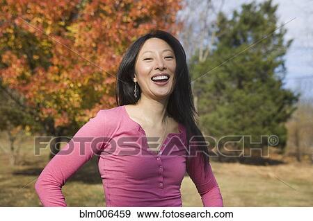 Laughing Asian woman View Large Photo Image Stock Photo - Laughing Asian woman. Fotosearch