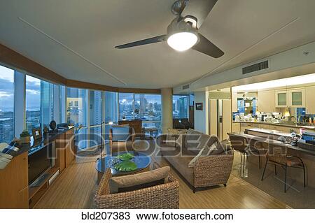 Stock Image - Living room in luxury highrise apartment. Fotosearch
