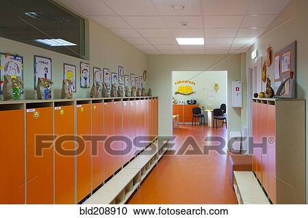 Locker room with orange locker doors, small benches and pictures on the wall View Large Photo Image Stock Image - Locker room with orange locker doors, small benches and pictures on the wall. Fotosearch