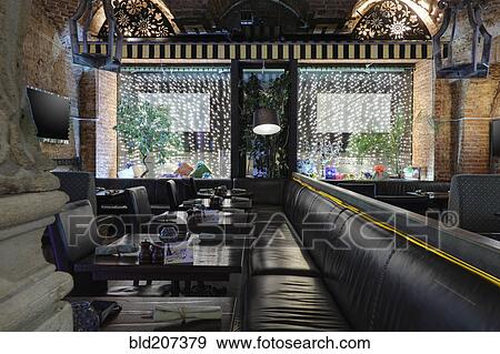 Stock Photo - Long leather seats in restaurant. Fotosearch