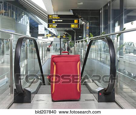 Stock Image - Luggage at the Top of an Escalator. Fotosearch