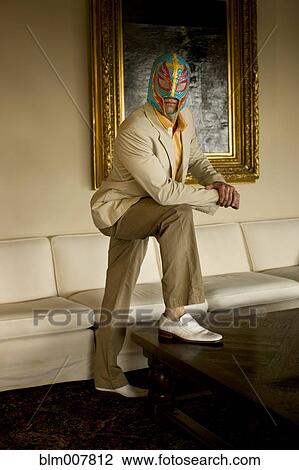 Man wearing wrestling mask in living room View Large Photo Image Stock Image - Man wearing wrestling mask in living room. Fotosearch