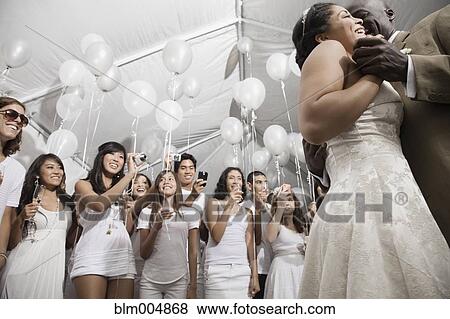 Stock Photo - Married couple dancing at wedding reception. Fotosearch