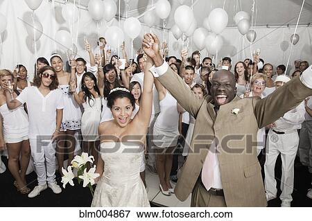 Stock Photo - Married couple enjoying wedding reception. Fotosearch