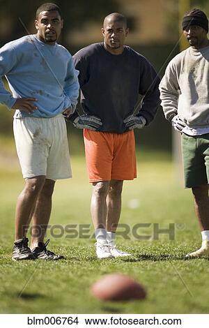 Men playing football View Large Photo Image Picture - Men playing football. Fotosearch