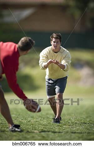 Men playing football View Large Photo Image Stock Photography - Men playing football. Fotosearch
