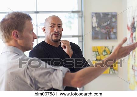 Men talking in art gallery View Large Photo Image Stock Image - Men talking in art gallery. Fotosearch