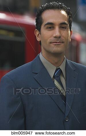 Stock Photo - Middle Eastern businessman smiling. Fotosearch