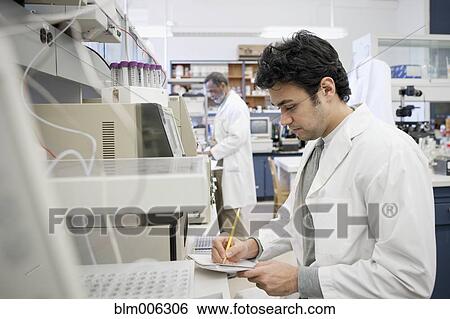 Stock Photograph - Middle Eastern scientist working in laboratory. Fotosearch