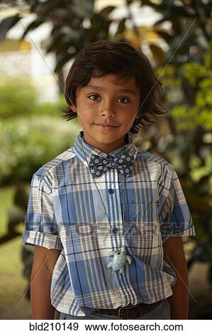 Stock Photo - Mixed race boy smiling outdoors. Fotosearch